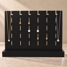 Earring and Necklace Stand in black acrylic, in use