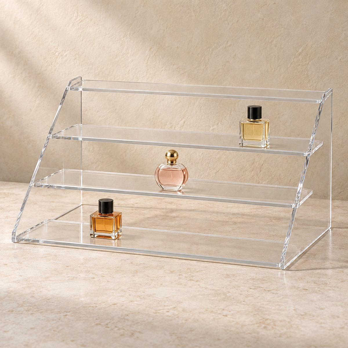 Four-Step Perfume Display Riser in clear acrylic, in use