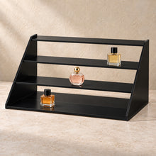 Four-Step Perfume Display Riser in black acrylic, in use