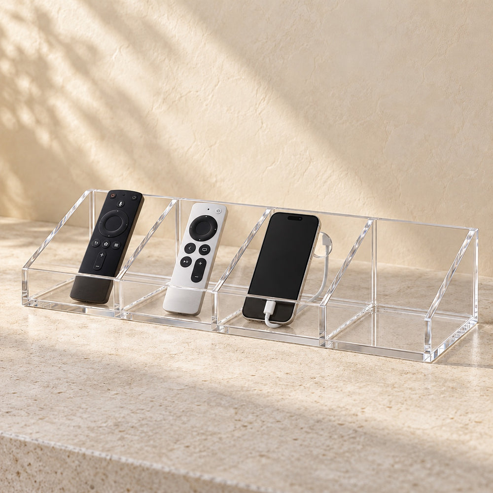 Bedside Remote and Phone Caddy in clear acrylic, in use