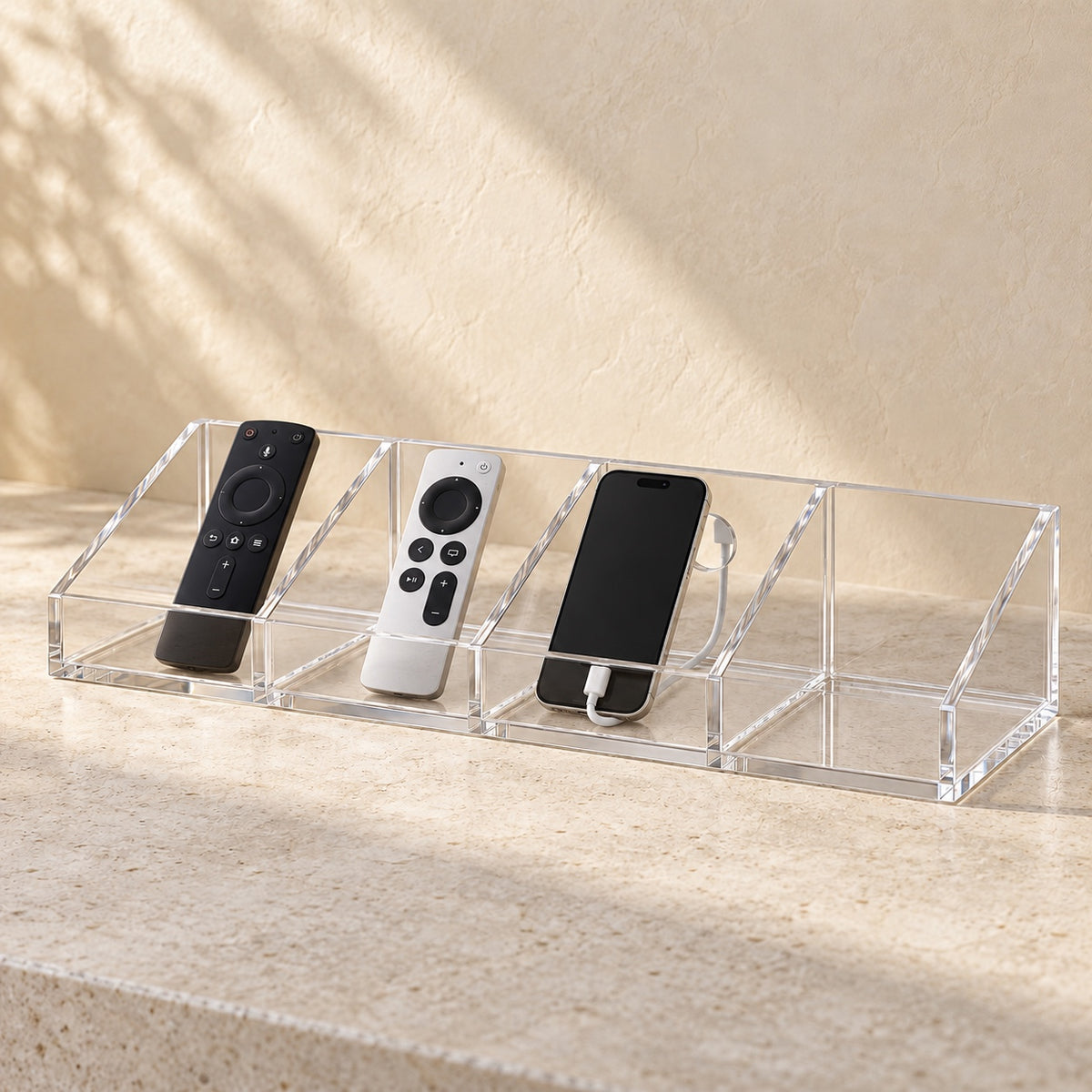 Bedside Remote and Phone Caddy in clear acrylic, in use