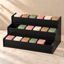 Three-Tier Tea Sachet Organiser in black acrylic, in use