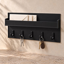 Key Holder with Mail Pocket in black acrylic, in use