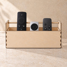 Remote Control Organiser in wood (birch plywood), in use