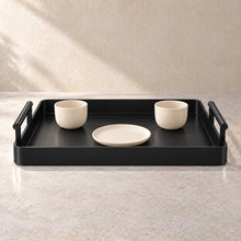 Serving Tray with Handles in black acrylic, in use