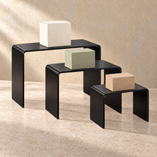 Display Riser Set of Three in black acrylic, in use