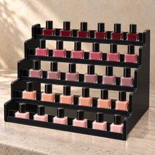 Five-Tier Nail Polish Display Rack in black acrylic, in use