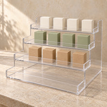 Four-Tier Retail Product Display in clear acrylic, in use