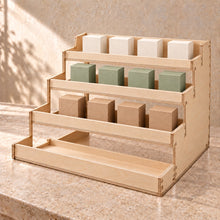 Four-Tier Retail Product Display in wood (birch plywood), in use
