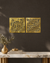 Set of two square Kufic acrylic panels, Surah Al-Falaq and Surah An-Nas, in mirror gold, float-mounted side by side on a pale wall.