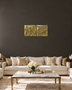 Set of two square Kufic acrylic panels, Surah Al-Falaq and Surah An-Nas, in mirror gold, float-mounted side by side on a pale wall.