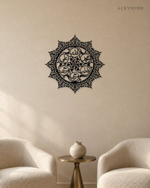 Panjtan Pak round acrylic medallion in gloss piano black, float-mounted on an ivory wall