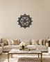 Panjtan Pak round acrylic medallion in gloss piano black, float-mounted on an ivory wall