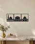 Set of three gloss black acrylic wall panels showing the silhouettes of Al-Masjid al-Haram, Al-Masjid an-Nabawi and Al-Aqsa, hung in a row on a pale wall.