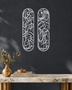 Pair of tall Arabic calligraphy acrylic panels in mirror Silver, float-mounted side by side on a cool graphite wall.