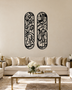 Pair of tall Arabic calligraphy acrylic panels in gloss Black, float-mounted side by side on a warm ivory wall.