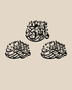 Three Quls Arabic calligraphy wall art in gloss black acrylic, one cluster above and two below, float-mounted on a pale wall.
