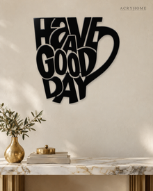 Have a Good Day Mug Silhouette Wall Art in gloss piano black acrylic, float-mounted on a pale ivory wall.