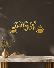 Coffee Bar Wall Sign with Cups and Beans for Kitchens in mirror gold acrylic, float-mounted on a deep charcoal wall.