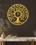 Tree of Life wall clock in mirror gold acrylic, fine laser-cut branches and leaves catching the light, clock face set into the centre of the trunk.