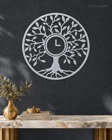 Tree of Life wall clock in mirror silver acrylic, circular leaf and branch cut work with the clock hands at the centre of the trunk.