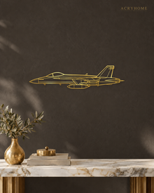 Fighter Jet Outline Wall Art for Pilots and Aviation Fans in mirror gold acrylic, float-mounted on a deep charcoal wall.