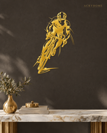 Road Cyclist in Full Sprint Wall Art for Home Gyms in mirror gold acrylic, float-mounted on a deep charcoal wall.