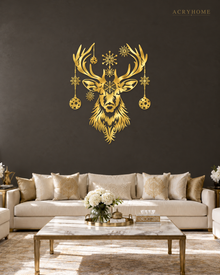 Stag Head Christmas Wall Art with Hanging Baubles and Snowflakes in mirror gold acrylic, float-mounted on a deep charcoal wall.