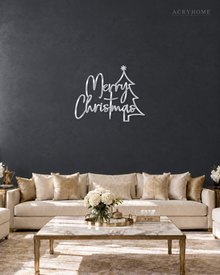 Merry Christmas Script Wall Sign with Outline Tree in mirror silver acrylic, float-mounted on a deep graphite wall.
