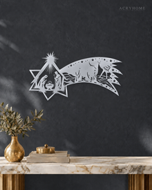 Nativity Scene Wall Art with a Sweeping Comet Star in mirror silver acrylic, float-mounted on a deep graphite wall.