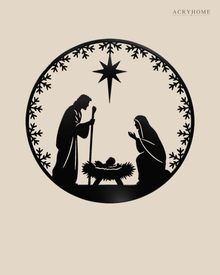 Round Nativity scene wall art in gloss piano black acrylic — Mary, Joseph and the manger beneath the star, ringed by a pine and snowflake wreath, float-mounted on a pale wall.