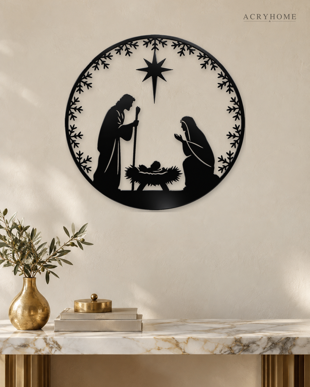 Round Nativity scene wall art in gloss piano black acrylic — Mary, Joseph and the manger beneath the star, ringed by a pine and snowflake wreath, float-mounted on a pale wall.