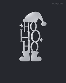 Ho Ho Ho Christmas Wall Art with Hat and Boots in mirror silver acrylic, float-mounted on a deep graphite wall.