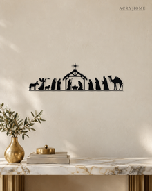 Wide Nativity Procession Wall Art with Camel and Angel in gloss piano black acrylic, float-mounted on a pale ivory wall.