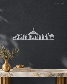 Wide Nativity Procession Wall Art with Camel and Angel in mirror silver acrylic, float-mounted on a deep graphite wall.