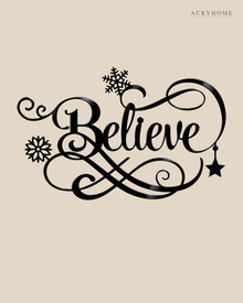 Believe in ornate flowing script with snowflake and flourish detail, laser-cut from gloss piano black acrylic and float-mounted above a console table.
