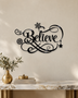 Believe in ornate flowing script with snowflake and flourish detail, laser-cut from gloss piano black acrylic and float-mounted above a console table.