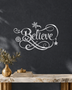 Believe in ornate flowing script with snowflake and flourish detail, laser-cut from mirror silver chrome acrylic and float-mounted over a mantel.