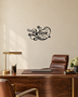 Believe in ornate flowing script with snowflake and flourish detail, laser-cut from gloss piano black acrylic and float-mounted above a console table.