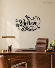 Believe in ornate flowing script with snowflake and flourish detail, laser-cut from gloss piano black acrylic and float-mounted above a console table.