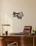 Stronger Every Day script wall art with flexed-arm icon in gloss piano black acrylic, float-mounted above a home gym bench.