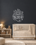 Kamal lotus wall art in mirror chrome silver acrylic — the Hindi word Kamal beneath a stylised lotus inside a vine-and-leaf arch, float-mounted on a neutral wall