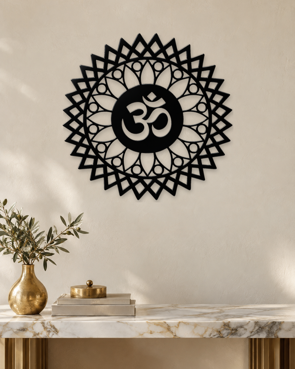 Gloss black acrylic Om sunburst mandala wall art, float-mounted on a pale wall with layered petal and diamond rings around the central Om symbol