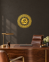 Mirror gold acrylic Om mandala wall art with geometric sunburst rings, float-mounted and catching warm light on a neutral wall