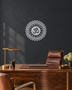 Mirror chrome acrylic Om sunburst mandala wall art, float-mounted so the layered petal rings cast a soft shadow on the wall