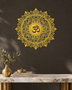 Om lotus mandala acrylic wall art in mirror gold, float-mounted on a dark espresso wall