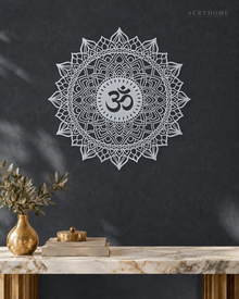 Om lotus mandala acrylic wall art in mirror silver, float-mounted on a cool graphite wall