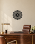Om lotus mandala acrylic wall art in gloss piano black, float-mounted on a light ivory wall
