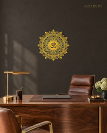 Om lotus mandala acrylic wall art in mirror gold, float-mounted on a dark espresso wall
