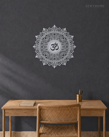 Om lotus mandala acrylic wall art in mirror silver, float-mounted on a cool graphite wall